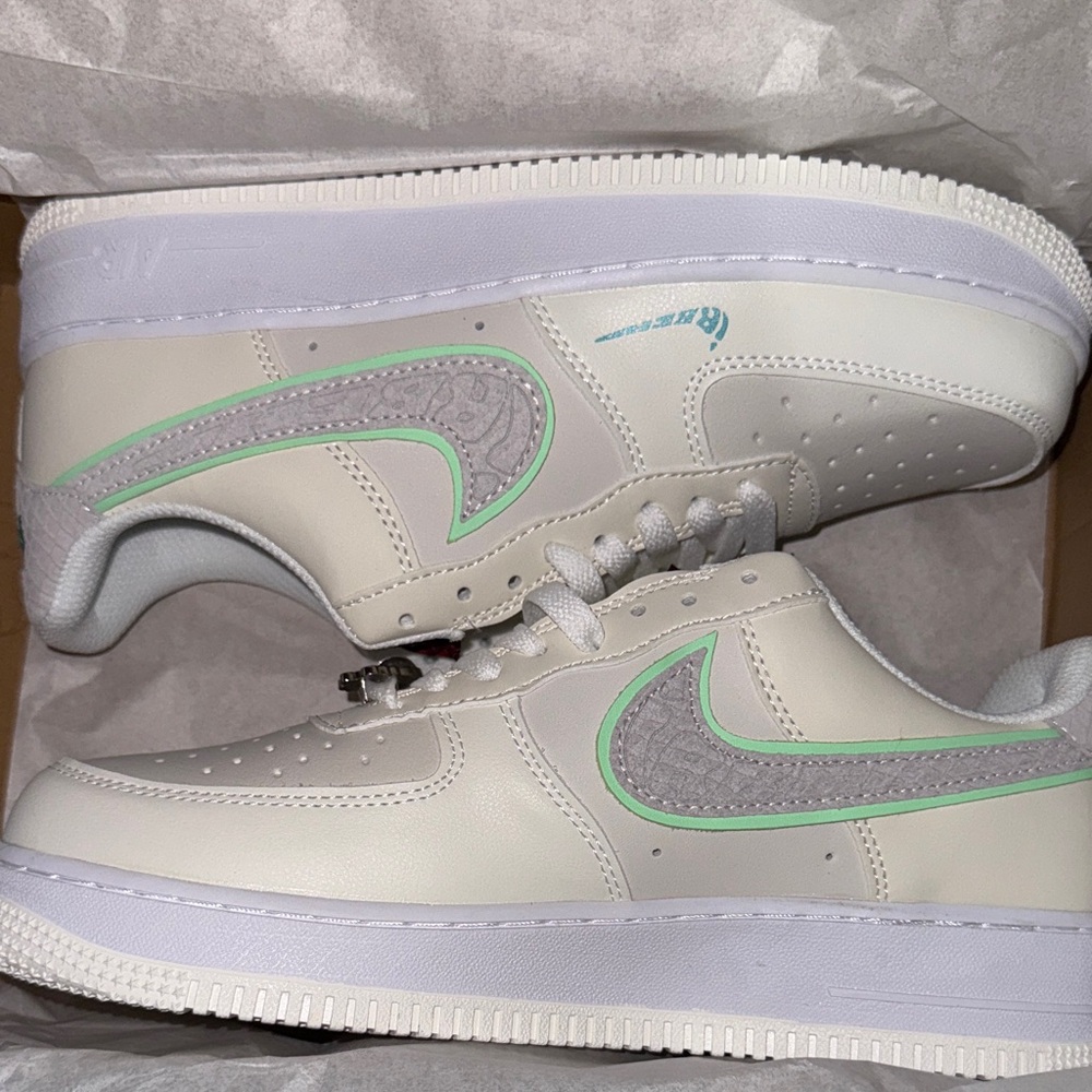 White and Gray Sneakers with Green Accents